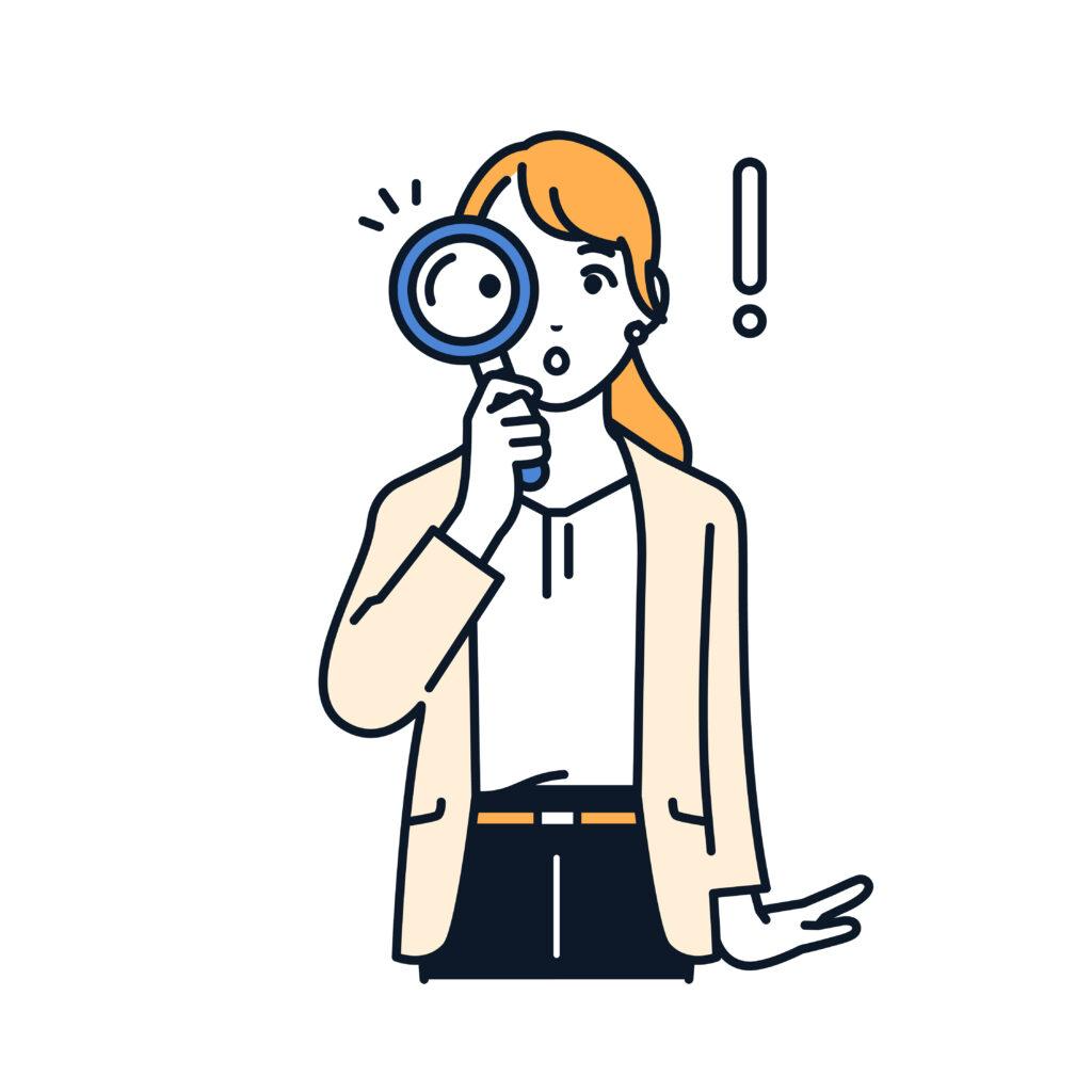 虫眼鏡を持っている女性